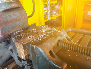 Metallurgy Iron drill heavy industry. Factory for production industrial machines. Low light close up shot,Closeup on the drill machine.