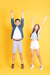 happy young couple in summer  casual clothes celebrating