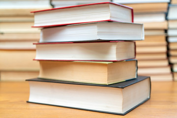 Stack of books in the library. Symbol of knowledge and learning.