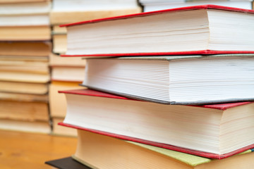 Stack of books in the library. Symbol of knowledge and learning.