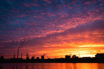 Thermal power plant at sunset