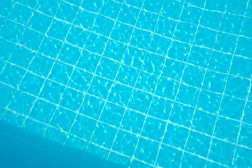 water rippled on swimming pool water surface for background