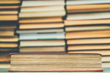 Old book in the red obnozhka. Symbol of knowledge and learning.