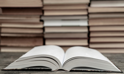 Opened thick book. Symbol of wisdom, knowledge and learning.