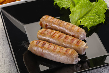 Grilled sausages served mushrooms and cabbage