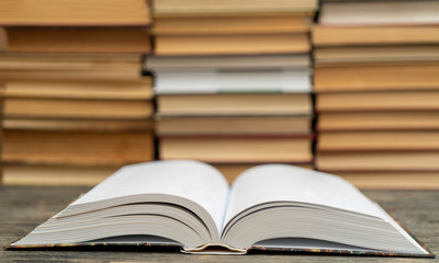 Opened thick book. Symbol of wisdom, knowledge and learning.