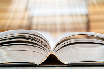 Book pages emit light. Symbol of wisdom, knowledge and learning.