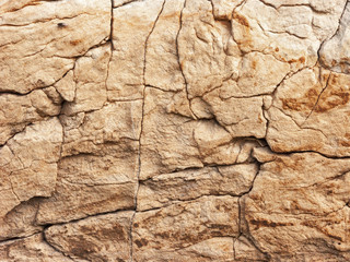 Typical detail of an ancient Italian house wall, made of hand-carved river stones.