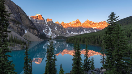 Panoramic view of sunrise in Banff National Park, Moraine lake, Canada.
