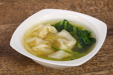 Asian traditional Wonton soup with herbs