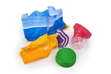 Plastic waste and bootle caps isolated on a white background