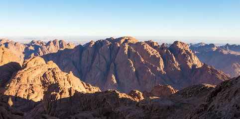 Fototapeta na wymiar Amazing Sunrise at Sinai Mountain, Mount Moses with a Bedouin, Beautiful view from the mountain 