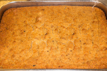 Freshly Baked Corn Bread Dressing:  Freshly baked corn bread dressing in a pan ready to be served...
