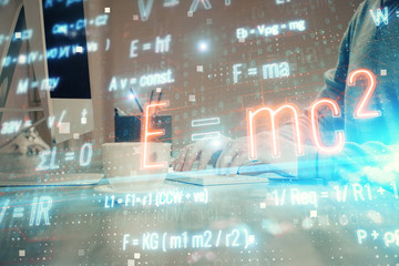 Science formula hologram with man working on computer on background. Education concept. Double exposure.