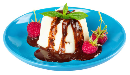 Cream pudding with chocolate sauce, raspberry and mint