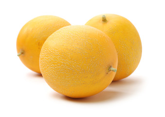 yellow honeydew melons isolated on white background 