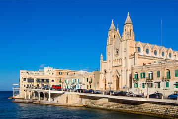 Naklejka na ściany i meble Malta, St Julians Bay. The .Carmelite Centre and church at the head of Balluta Bay