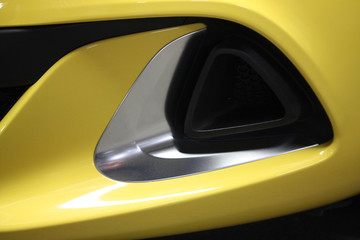 Abstract macro detail of yellow sportscar