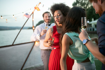 Group of friends having fun and celebrating group gathering