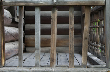 Fototapeta na wymiar Old wooden railing near the house