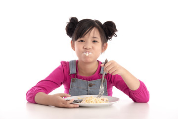 Cute asian girl eating Spaghetti Carbonara