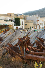 Anchors and house of Favignana island. Egadi, Sicily, Itlay
