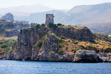 Rocks and ancient roman tower. Riserva dello Zingaro. Sicily. Italy. National park Zingaro