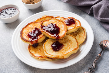 Cottage cheese pancakes with jam and tea. Concept healthy Breakfast.