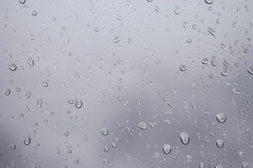 Raindrops on the window pane Atmospheric phenomenon expressed by high humidity and precipitation.