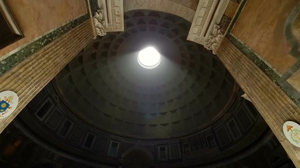 Rome Italy Pantheon popular tourist destination in Rome. The Dome Of The Pantheon. A light beam shines from the roof of the dome. - Powered by Adobe
