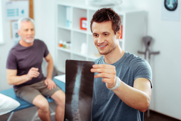 Nice positive man being happy for the patient