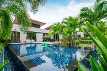 Fototapeta premium home or house building Exterior and interior design showing tropical pool villa with green garden