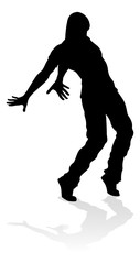 A male street dance hip hop dancer in silhouette