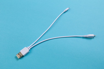 USB Micro cables ob blue background. Connectors and sockets for PC and mobile devices- Image