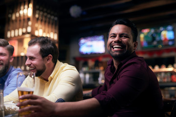 Men watching american football in the pub
