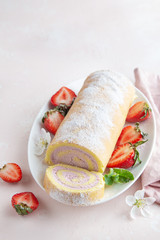 strawberry swiss roll  cake on white plate