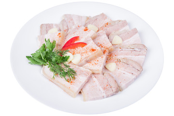 Sliced baked meat with garlic in a plate