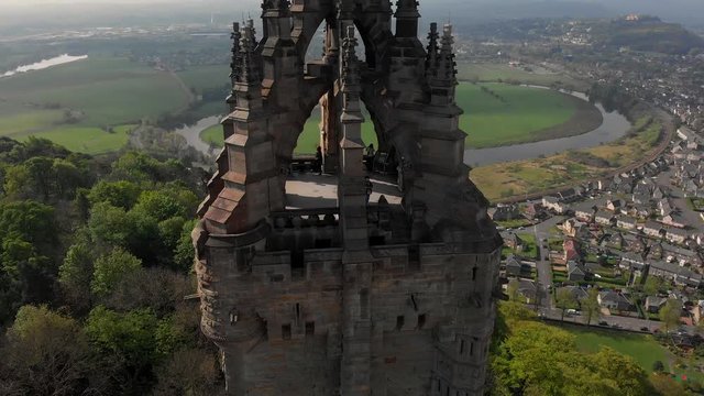 Aerial Drone shot of the William Wallace Monument in Stirling Scotland. This shot begins close to the monument, and then moves even closer.