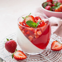 coconut and strawberry jelly layered dessert with fresh berry