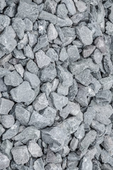 Crushed grey stone on the ground texture background