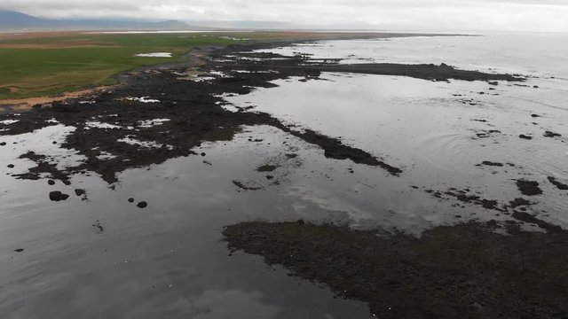 Aerial footage over Ytri Tunga beach in Iceland. Showing parts of the shallow beach famous for its many seals.