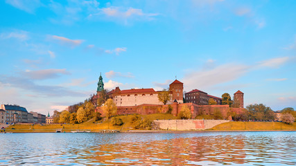 Naklejka na ściany i meble Panoramatic view of Wawel Castle via Vistula river on a bright day in Autumn, Krakow, Poland