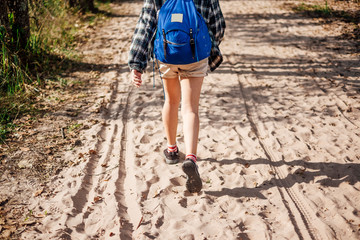 backpacker girl walk alone in pathway