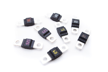 Midi blade fuses with different ampers on isolated white backgrounds. Electric car parts.
