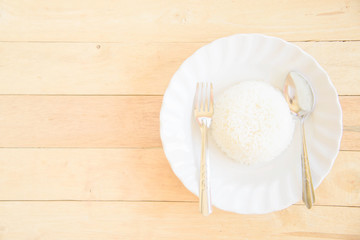Fototapeta na wymiar rice cooked in a dish on wood plate