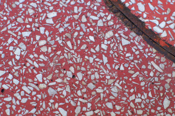 Red and white based flooring. Rusted structure.