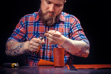 Leather master producing leather goods 