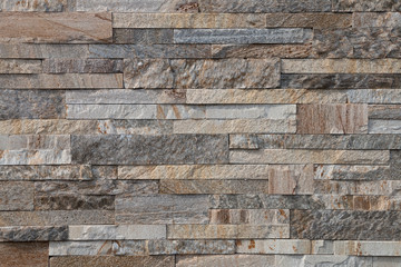 Background, texture, laying of natural stone and blocks of gray shades.