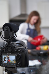 Obraz na płótnie Canvas Female Vlogger Making Social Media Video About Cooking For The Internet