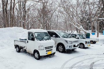 Fototapeta na wymiar Frozen cars in winter season in Japan